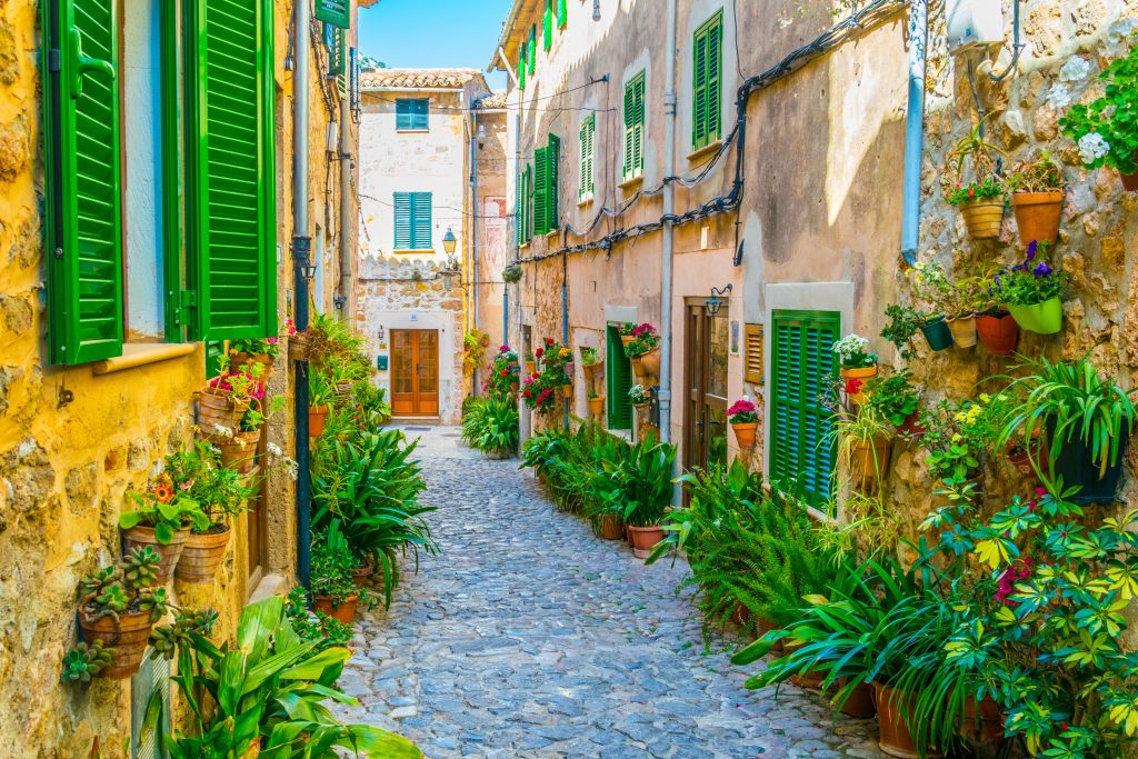 View of a narrow street in the spanish town Valldemossa at Mallorca